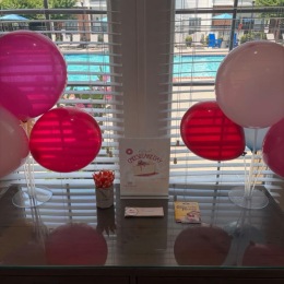 table with balloons on it